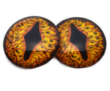 Pair of dragon eye-shaped lenses with fiery design on a white background