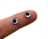 Pale Blue and Orange Glass Fish Eyes