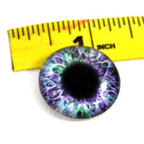 purple and green glass eye