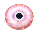 Artificial eye with pink and orange marbled pattern on a white background