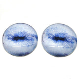Contracted pale blue goat glass eyes