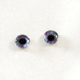 purple and green glass doll eyes