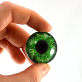 green human glass eye